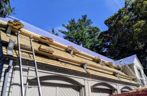 Once a new roof is installed, it is important to keep it clean. Regularly clean debris out of gutters and off the roof, both the surface areas and the keyways between shakes or shingles, so the roof lasts longer.