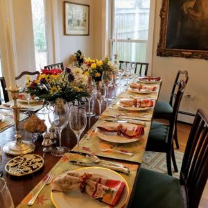 Marquee brand manager, Sabrina Blaustein, celebrated Thanksgiving at her boyfriend's parents' home in Katonah, New York. The hosts, Gina Reid and Chris Maxmin, gathered together at this beautifully set table dressed with autumnal decor, speckled with warm-colored accents and fresh blooms Gina arranged earlier in the day.