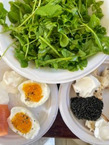 A good business trip always starts with a good meal. If you follow me on my Instagram page @MarthaStewart48, you may have seen this - a flavorful lunch of smoked salmon, bagels, caviar, eggs from my wonderful hens, and greens from my garden.