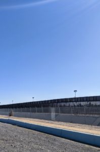 The wall stretches for miles over both urban and uninhabited sections. The urban areas include San Diego, California and El Paso, Texas.