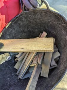 All the wooden stakes, strips and shims get reused from year to year. Even scraps of wood can be repurposed for various projects. The strips are about six to eight inches long – just long enough to accommodate two screws that will keep the burlap secure for the season.