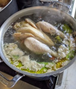 I have four dogs - my Chow Chows, Emperor Han and Empress Qin, and my French Bulldogs, Bete Noire and Creme Brulee. Having multiple dogs means there’s a lot to prepare. Here is one of several roosters cooking with some added vegetables to the stock.