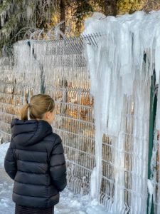 It was bitterly cold in China - sub-zero temperatures. Here is Jude looking at some of the massive icicles that were hanging at the base of The Great Wall.