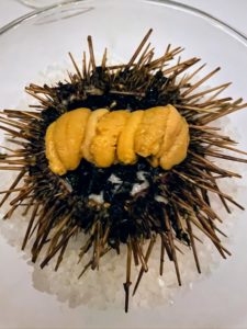 And this is cooked uni. Five strips or “tongues” of uni live within the structure of a sea urchin. They are usually orange or yellowish, and do resemble tongues, with the consistency of firm custard.