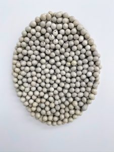 I admired this one because it is made from eggs. It is called "Ovale d’oeufs 1234567," which translates to "Oval of eggs 1234567" (1965) by Marcel Broodthaers.