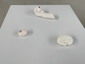 In this group, clockwise from the top: "Hand holding egg" (2007), "Handheld bird" (2006) and "Chicken" (2007) - all by Charles Ray.