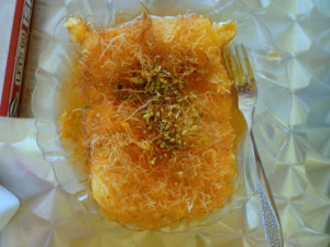Kuneifa, a Middle Eastern dessert, made with milk, orange blossom water, and wheat