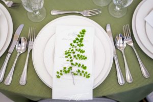 Each of the napkins at Nicolette's table was topped with leaves - simple, yet elegant. (Photo by @fredmarcusstudio)