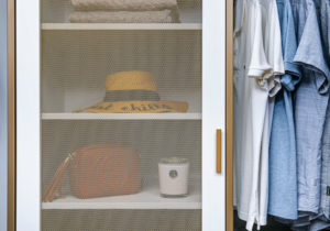 The mesh metal door on this 3-drawer cabinet allows items to breathe. This design feature was inspired by my daughter's closets. Once the configuration is planned, the system is shipped for self-installation, or California Closets can do it for you. (Photo by Andy Frame, andyframe.com)