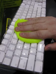 Cyber Clean http://www.cyberclean.ch/ is used to remove dust and crumbs from key boards.