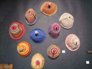Another booth offered native art, even these vibrant hand knit caps from Africa.