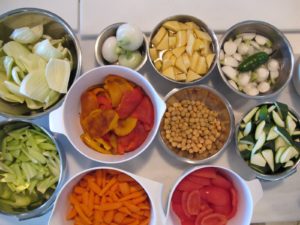 Celery, onion, rutabaga, white turnip, red and yellow roasted peppers, chick peas, zucchini, celery, carrots, eggplant, and peeled and seeded plum tomatoes.