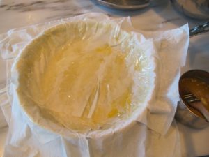 To form the bisteeya - Moroccan 'pigeon' pie - Pierre lined a baking dish with sheets of tissue-thin phyllo dough, brushing each sheet with melted butter, which makes it especially flaky.