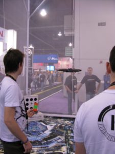 This French company was demonstrating the Parrot's AR.Drone, http://www.parrot.com/ I was told you can control it with your iPod.