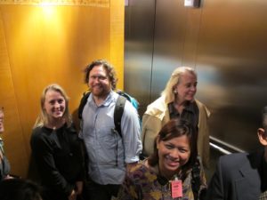Jori, Zack, Memrie, and Normasila  in an elevator at Kuala Lumpur International Airport. So happy to be here!