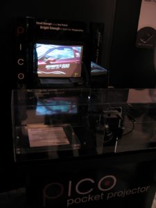 You can project your photos and movies with a pocket PICO projector. www.optomausa.com/