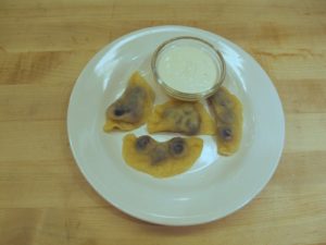 The blueberry pierogi are delicious with sweetened sour cream flavored with a touch of vanilla.
