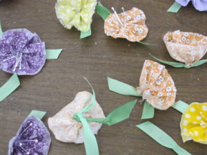 Our Craft Department created these adorable hand-made boutonnieres for the catering staff to wear!