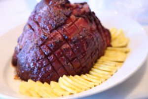 Our new Niman Ranch ham from Costco, glazed with brown sugar and cognac, served with fresh slices of pineapple.