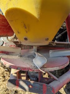 These are slinger blades that help to direct the lime as it is thrown from the spreader.