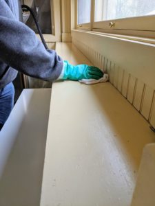 And then wipes down the ledge where the crew keeps small items such as hats and gloves, etc. It's always a good idea to wear disposable gloves whenever cleaning and disinfecting surfaces.