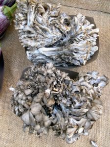 We saw several mushroom varieties. These are maitake mushrooms. Maitake means "dancing mushroom" in Japanese. The mushroom grows wild in parts of Japan, China, and North America.