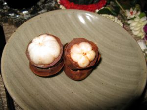 These fruits are called mangosteen and they vary so much - the plumper fruit on the left was sweeter and juicier.