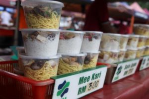 A variety of Asian noodles with various toppings