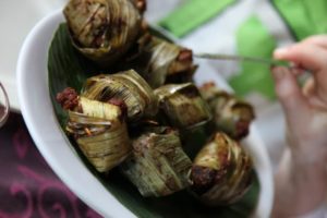 Morsels of chicken wrapped in bamboo leaf and grilled