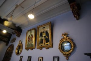 Hanging on the walls are elaborately framed portraits of generations of the Wee family, who owned the house.