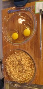 The ingredients for the peanut-crusted chicken breasts - Boneless/skinless chicken breasts are first dipped into beaten egg and then dredged in chopped peanuts mixed with breadcrumbs.