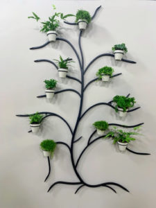 And here it is in black. These decorative trees can be used indoors and out. It comes with 11-pots for all your little plantings.