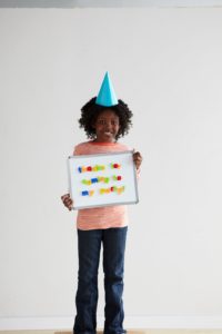 Inspire your child to write thank-you notes by having him or her hold a magnetic alphabet board with the message spelled out.