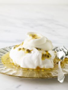 This delicious Pavlova combines tart passion fruit with crisp-soft meringue and slightly sweetened whipped cream.