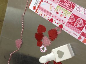 Another craft project was putting together a heart garland using heart punches and red and white twine.