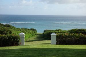 In all, the property consists of 265 acres set on a high hill.  These 2 gate posts lead to the ocean where there is a wide cut in the coral reef (where there is no surf).  This coral was used as a building material for the original home.