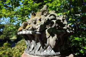 In the Green Garden, there are four of these amazing baskets of flower ornaments, designed by Beatrix Farrand and Armand Albert Rateau, c. 1930; limestone and lead.