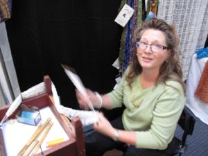 This is Stephanie Crossman of Gram J's Nets - http://www.mainenetbags.com/index.html - Stephanie makes lovely bags and jewelry with traditional knotted netting, otherwise known as fishnetting.