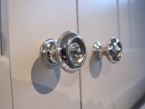 These Button Knobs are Polished Nickel.