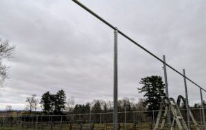 The loop caps are also used to secure the top crossbar to the vertical supports.