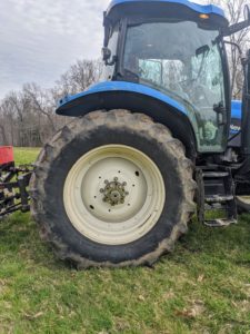 The tires of Alan's tractor are specifically designed for agricultural use. The extra-large tread pattern allow the vehicle to stay above the soil without getting stuck, especially in moist patches.