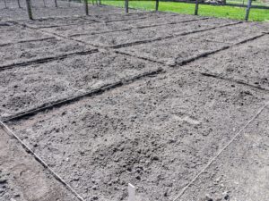The width of each bed is just wide enough to grow two rows of vegetables and still reach them at harvest time. When building raised beds, be sure every part can be reached without standing on it. Let this be a number one “ground” rule – never step on the soil within raised beds.