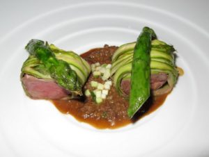 A tender loin of lamb wrapped with asparagus ribbons