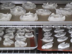 For dessert, Pierre made assorted shapes and sizes of meringue.  Here they are baking at low heat in the convection oven.