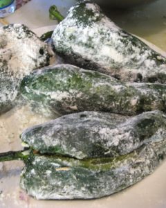 These are roasted poblano peppers filled with local white cheese and dusted with flour.
