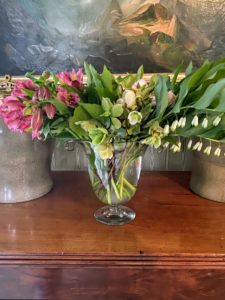 Here are some hellebores, lilies, and Solomon's Seal in a vase in my foyer. Gorgeous arrangements don’t always have to be giant in size - they can also be small with stems hanging over the sides of the vase.