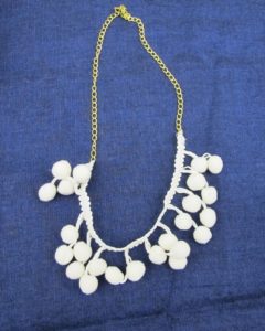Handle & Spout made lovely necklaces using chenille pom-poms.  http://handlespout.bigcartel.com/