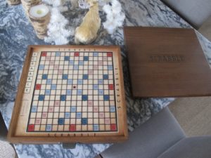 It has embossed wood tiles, a rectangular raised letter grid, and metal tile racks.  I could barely wait to get a game started.