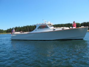 This is my beautiful 36-foot classic Hinkley picnic boat.  I love this craft for its sleekness, its speed, and its roominess.  I christened it Skylands II.