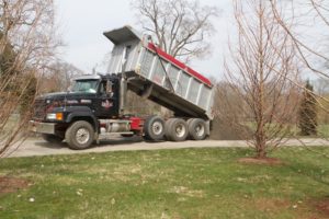 Bruce Corbett, who built the carriage roads at my farm, has been doing spring maintenance on all of the roadways.  Here he is dumping a load of gravel.